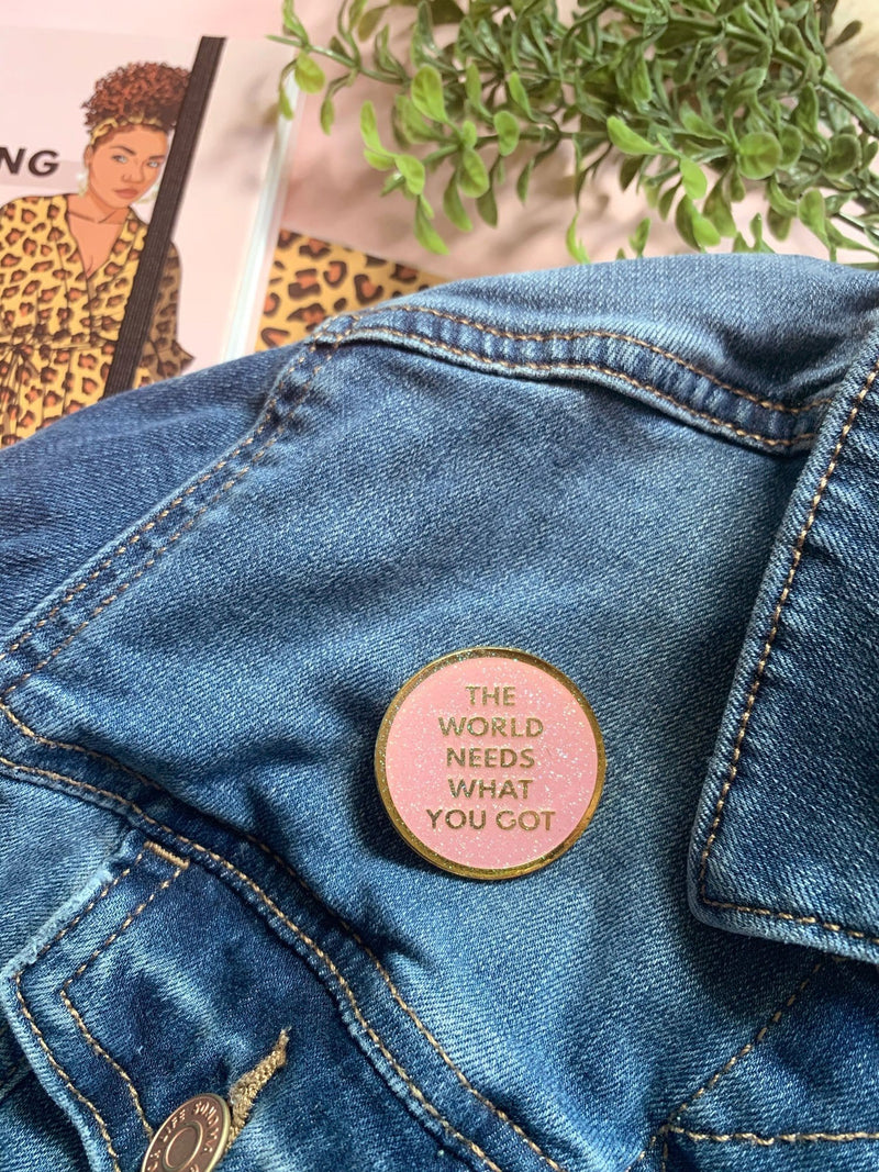 What You Got enamel pin shown being used as a lapel pin for denim jacket