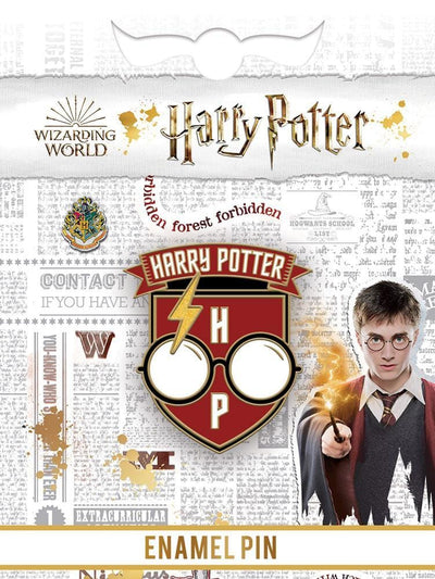 Harry Potter Glasses enamel pin shown in packaging featuring Hogwarts crest, gray background text and photo of Harry Potter with wand.