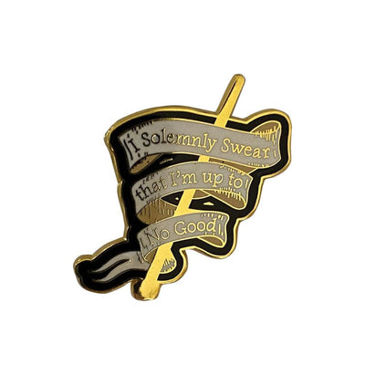 enamel pin featuring the Solemnly Swear quote in a banner with black and gold details.
