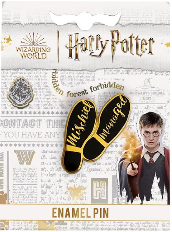 Harry Potter enamel pin shown in packaging, featuring the words, Mischief Managed on the soles of shoes with black and gold details.