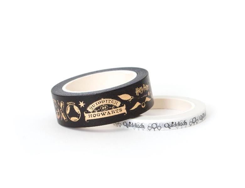 2 rolls of Harry Potter ™ washi tape featuring quidditch and hogwarts symbols in black and gold, shown on white background.