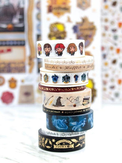 Harry Potter ™ washi tape featuring 10 rolls stacked, shown against a soft background of Harry Potter stickers.