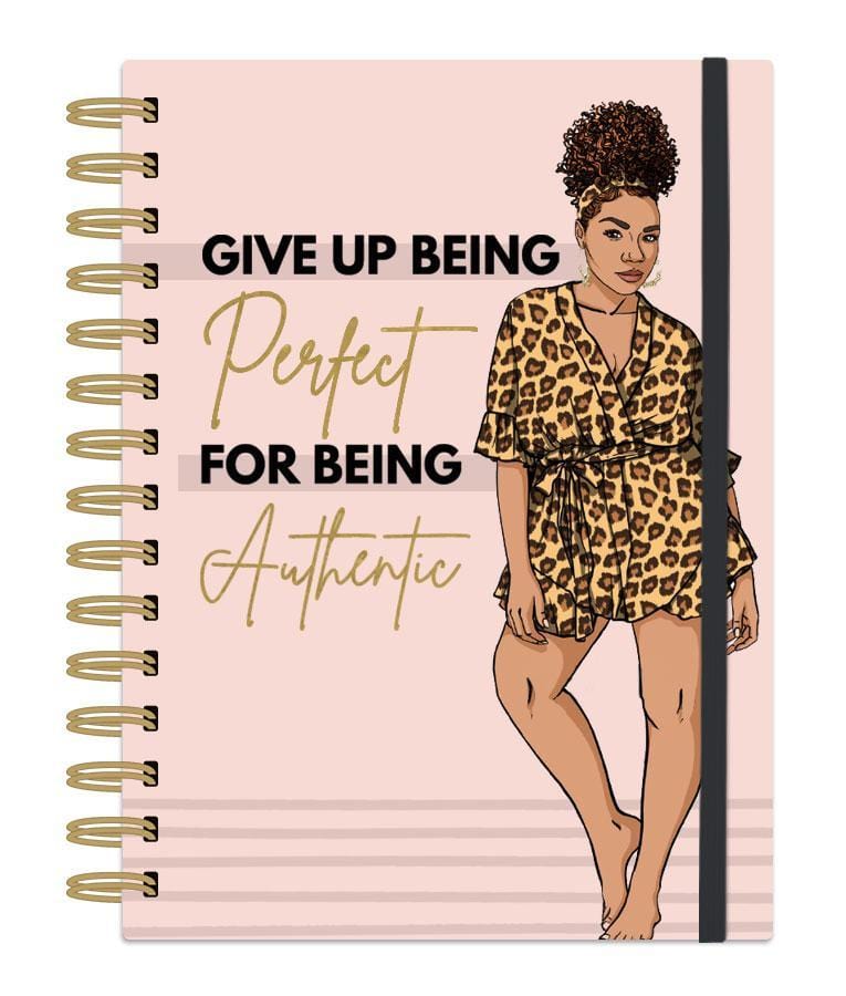 journal notebook featuring light pink cover with "Be Authentic" phrase and woman wearing a cheetah print robe. gold spiral, gold foil details  and black elastic page holder.