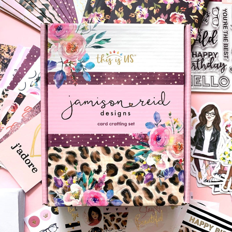 Card craft kit is shown in package featuring floral designs and cheetah print. Contents of package are shown scattered behind box.  