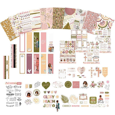 The full assortment of items from this bible journaling craft kit are shown featuring patterns, illustrations and spiritual sayings depicted in beautiful soft, muted colors.