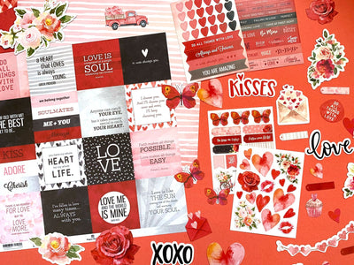 this craft kit image features red, black and pink themed scrapbook papers, stickers, and diecuts featuring hearts, roses and words shown on a red background.
