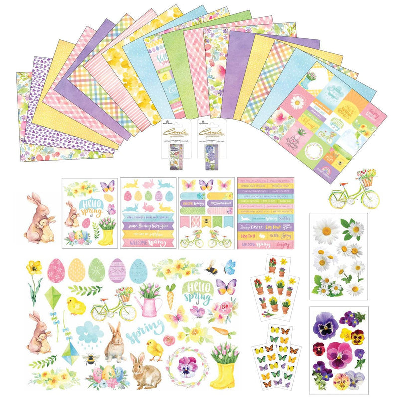 This craft kit image features scrapbook papers fanned out, washi tape in packages, sticker sheets and scrapbook die cuts. All spring themed and shown on a white background.