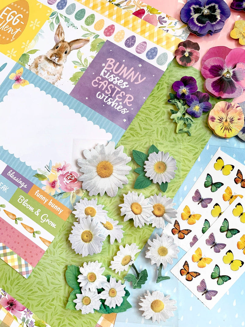 this craft kit image features close up of spring themed scrapbook papers and stickers.