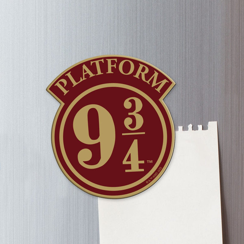 fridge magnet featuring Platform 9 3/4 shaped sign on a metal background attached to a torn sheet of white memo paper.