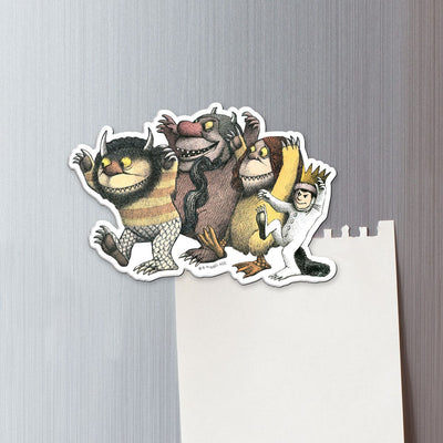 fridge magnet featuring 4 characters from Where the Wild Things Are shown on a metal background attached to a torn sheet of white memo paper.