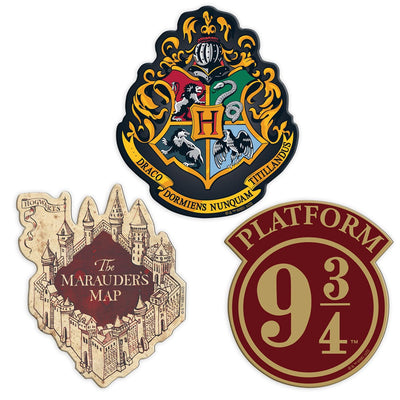 Three Harry Potter shaped magnets featuring the Hogwarts crest, the Marauder's Map and Platform 9 3/4 are shown on a white background.