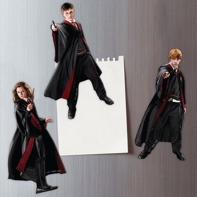 Three Harry Potter fridge magnets featuring photo real diecut images of Harry, Hermione and Ron on a metal background attached to a white memo sheet.