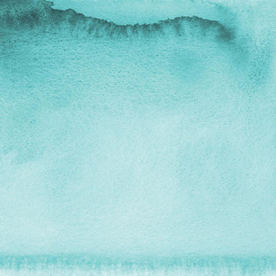 scrapbook paper featuring a teal watercolor wash.