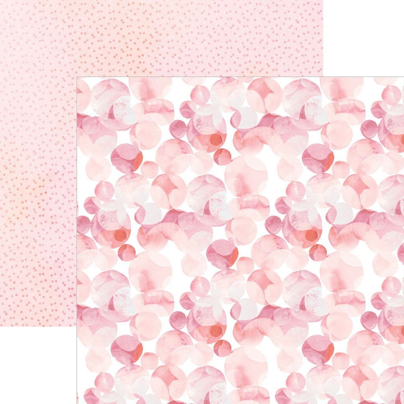 scrapbook paper image features a large pink dot pattern on front side and a small pink dot pattern on back side.
