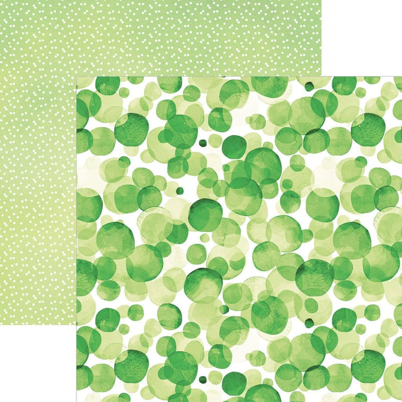 scrapbook paper image features a large green dot pattern on front side and a small white on green dot pattern on back side.