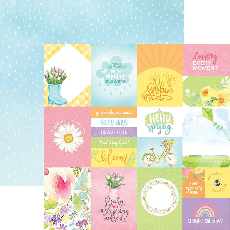 This scrapbook paper features pastel spring illustrations and sentiments on one side, overlapping a blue rain pattern.