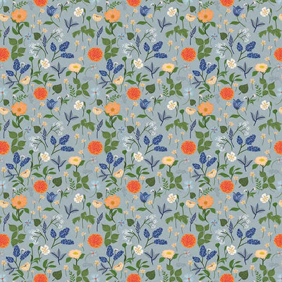 scrapbook paper featuring an illustrated pattern of florals on a blue background