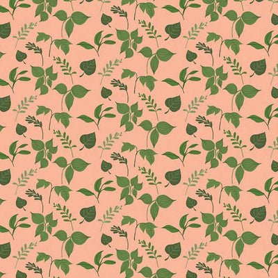 scrapbook paper featuring an illustrated green leaf pattern on a peach background.