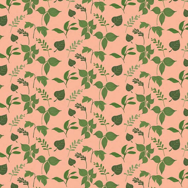 scrapbook paper featuring an illustrated green leaf pattern on a peach background.