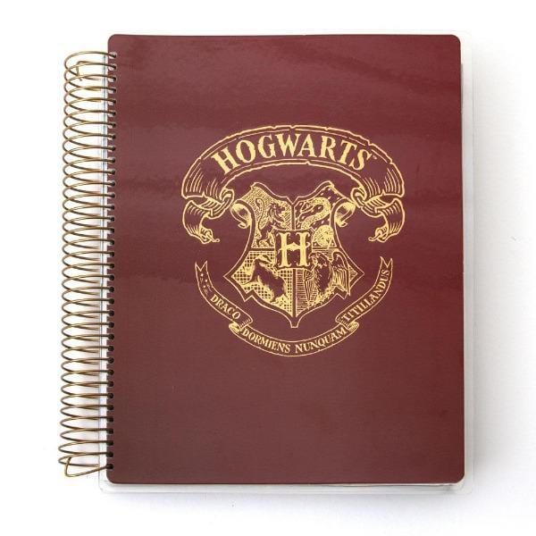 Harry Potter Hogwarts weekly planner image shows cover featuring a gold illustration of the crest on a solid red background with gold coil spine.