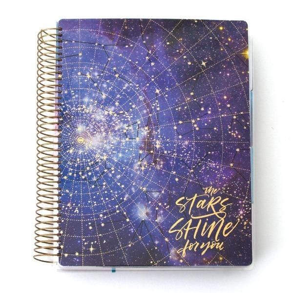 Stargazer weekly planner image shows cover featuring galaxy with gold text and gold coil spine.