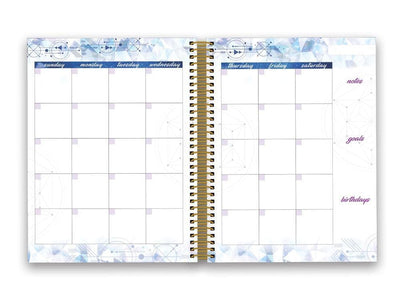 Stargazer weekly planner shown open to a monthly spread featuring blue borders.