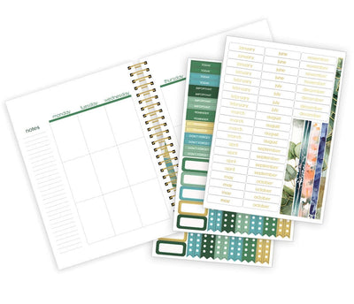 weekly planner featuring a weekly spread and 3 sheets of stickers with green and gold details, shown on white background.
