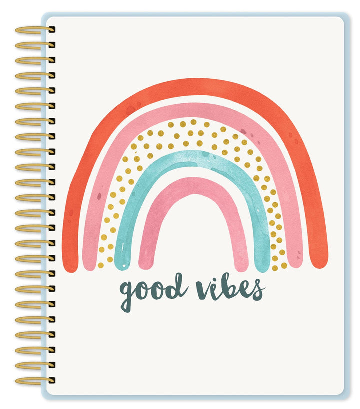 Good vibes weekly planner featuring an illustrated rainbow with gold details and gold coil spine, shown on white background.