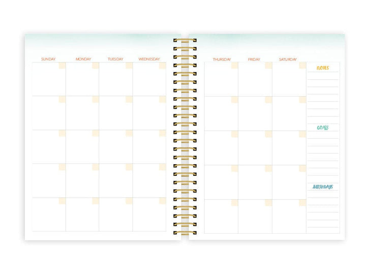 weekly planner featuring monthly spread with gold coil spine shown on white background.