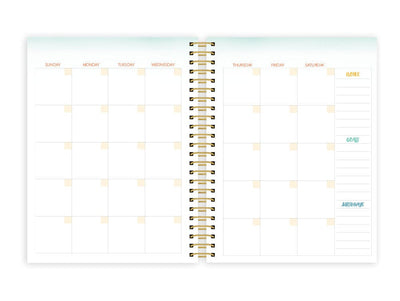 weekly planner featuring monthly spread with gold coil spine shown on white background.