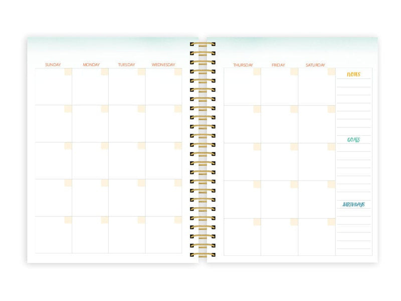 weekly planner featuring monthly spread with gold coil spine shown on white background.
