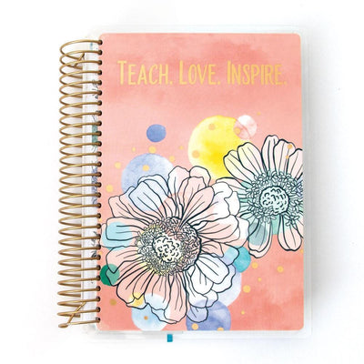 Teacher mini academic planner image shows cover featuring floral illustration on a peach background with gold coil spine.