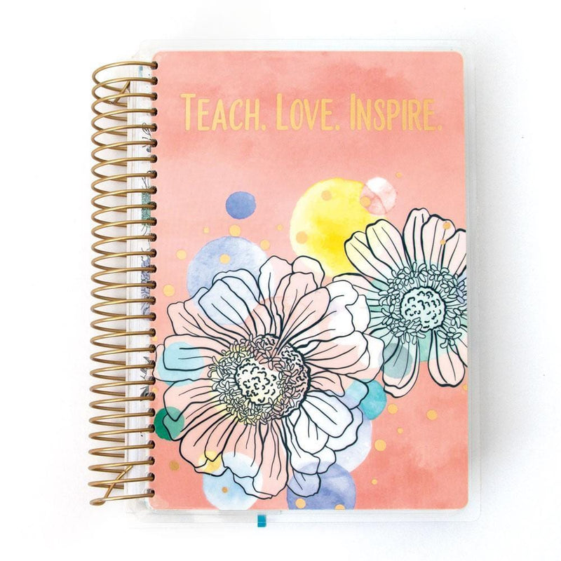 Teacher mini academic planner image shows cover featuring floral illustration on a peach background with gold coil spine.