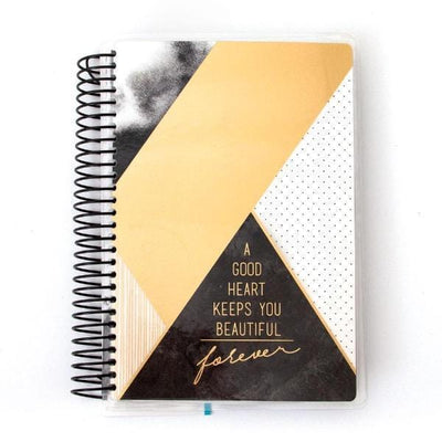 Mini weekly planner image shows cover featuring black and gold geometric patterns and black coil spine.
