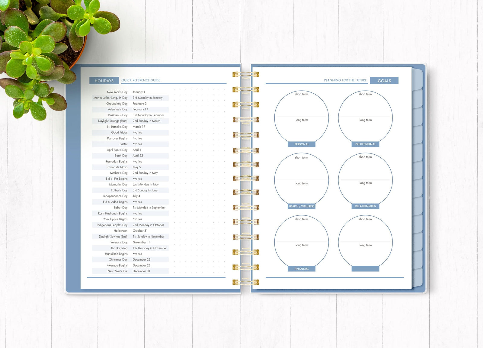 Wild and Free planner organizer image shown open to an inside spread featuring holidays and goals.