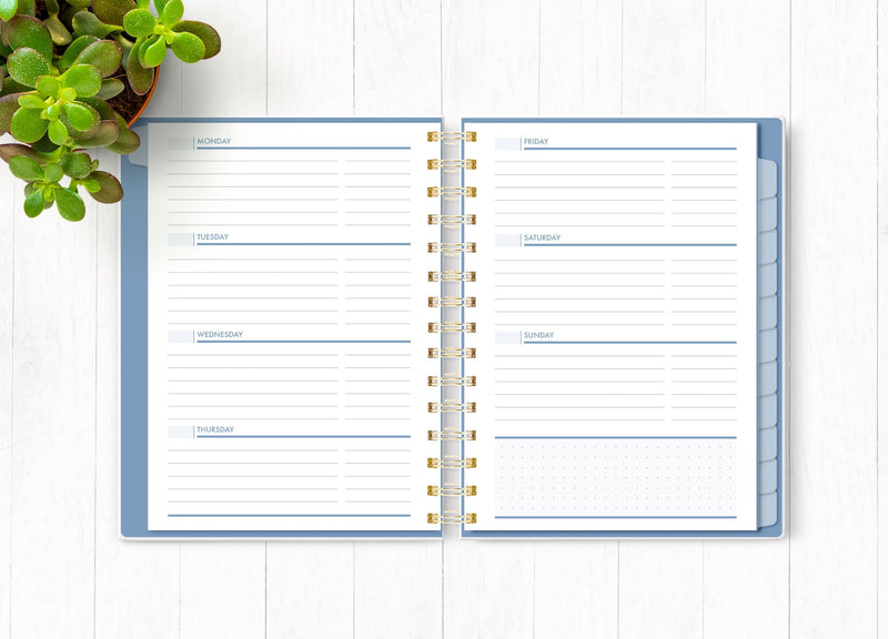 Wild and Free planner organizer image shown open to an inside weekly spread.