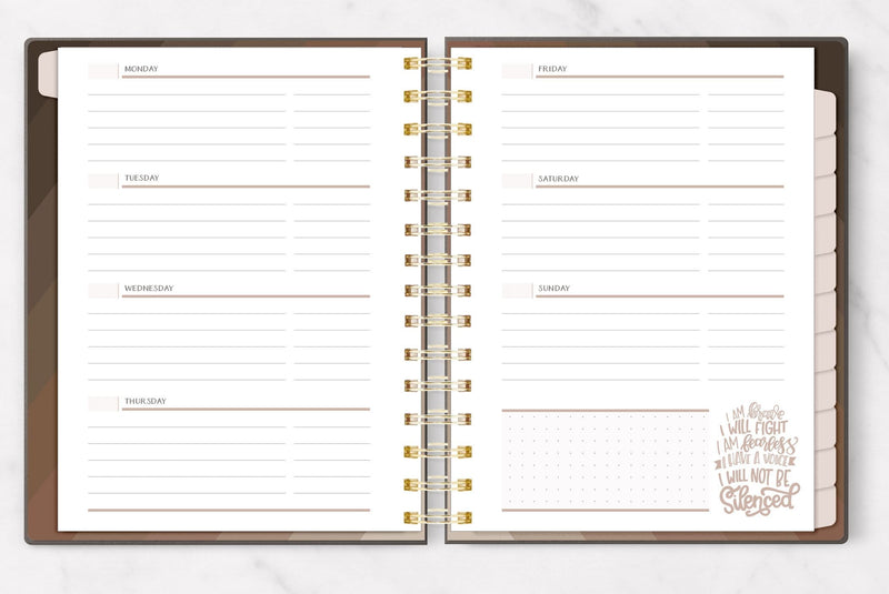 weekly planner featuring an open spread  showing each day of the week with lines.