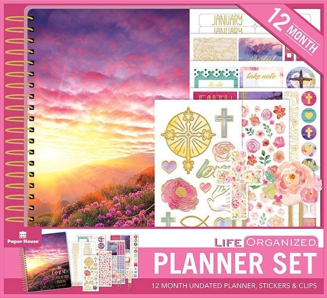 Faithful weekly planner set shows package featuring pink sunset on cover and multiple sticker sheets.