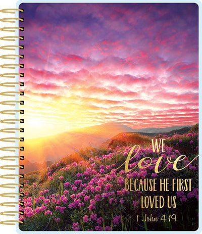 Faithful weekly planner set shows cover featuring pink sunset and gold coil spine.