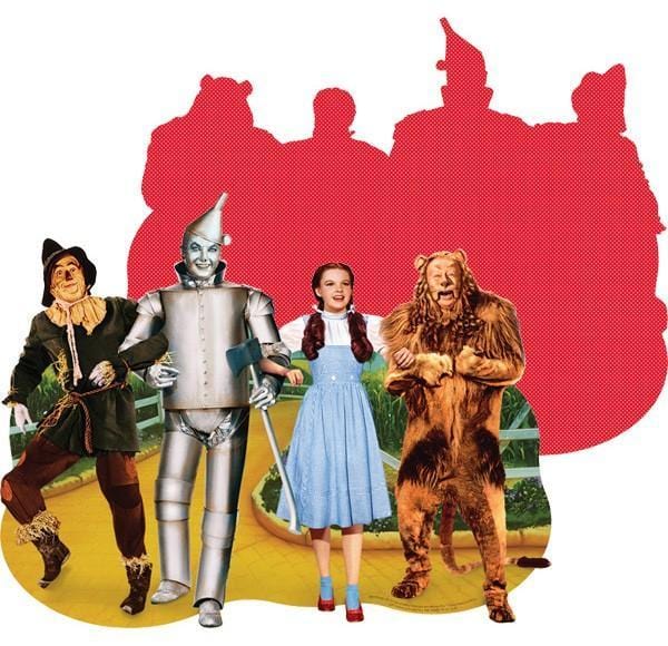 jigsaw puzzle featuring shaped image of the Wizard of Oz characters on the front and a red pattern on the back.
