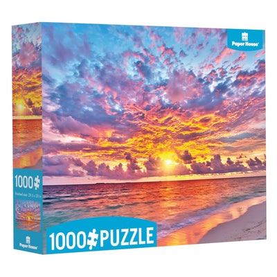 jigsaw puzzle box featuring image of a colorful seaside sunset.