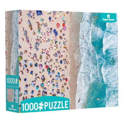 jigsaw puzzle box featuring overhead view of beach scene.