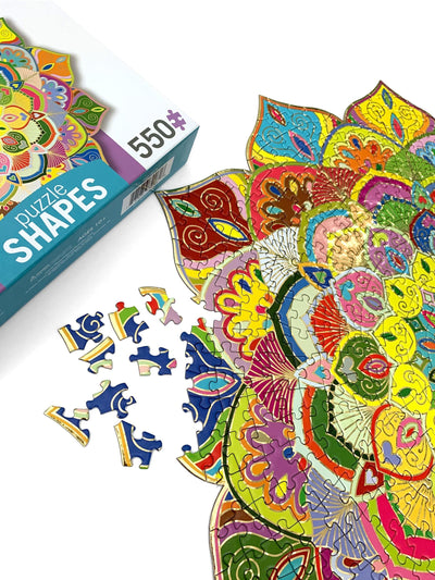 Mandala jigsaw puzzle image featuring colorful, shaped mandala puzzle with pieces alongside the box.