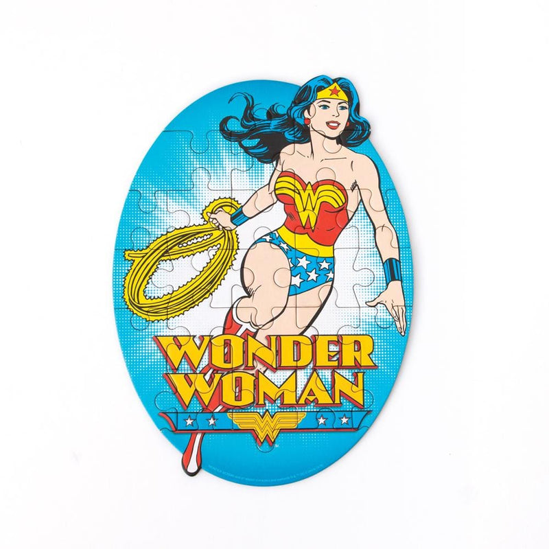mini die cut jigsaw puzzle featuring wonder woman on a bright blue background, shown on a white background.