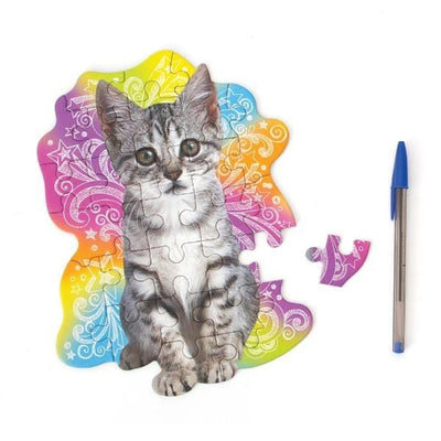 die cut mini jigsaw puzzle featuring a photo real kitten on a colorful background, shown with pen and one separate piece on white background.