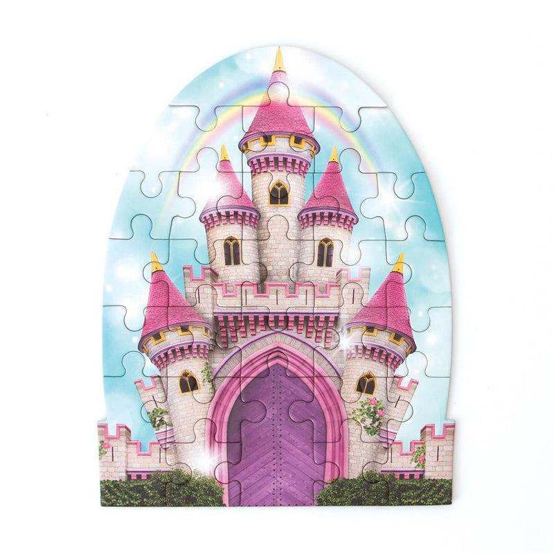die cut mini jigsaw puzzle featuring an illustrated pink castle with rainbow, shown on white background.