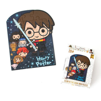 die cut mini jigsaw puzzle featuring chibi Harry Potter with package, on white background.