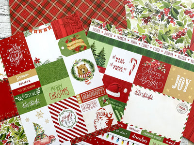 This craft kit image shows overlapping scrapbook papers featuring Christmas themed tags and patterns with red, green and gold details.