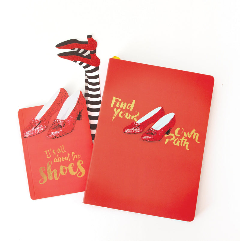 Wizard of Oz journal notebook set featuring 2 red notebooks with ruby slippers and gold lettering plus a ruby slipper bookmark, shown on a white background.