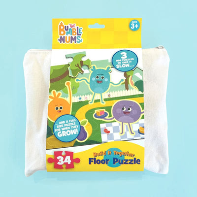 Floor puzzle featuring the bumble nums in package, shown on light blue background.